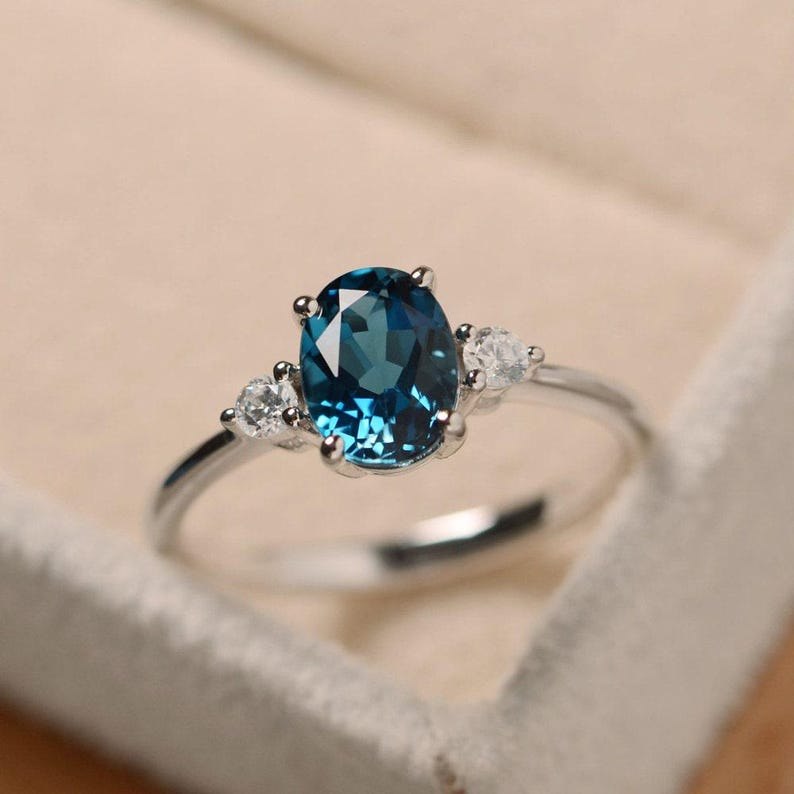 Oval Cut Blue Topaz Ring