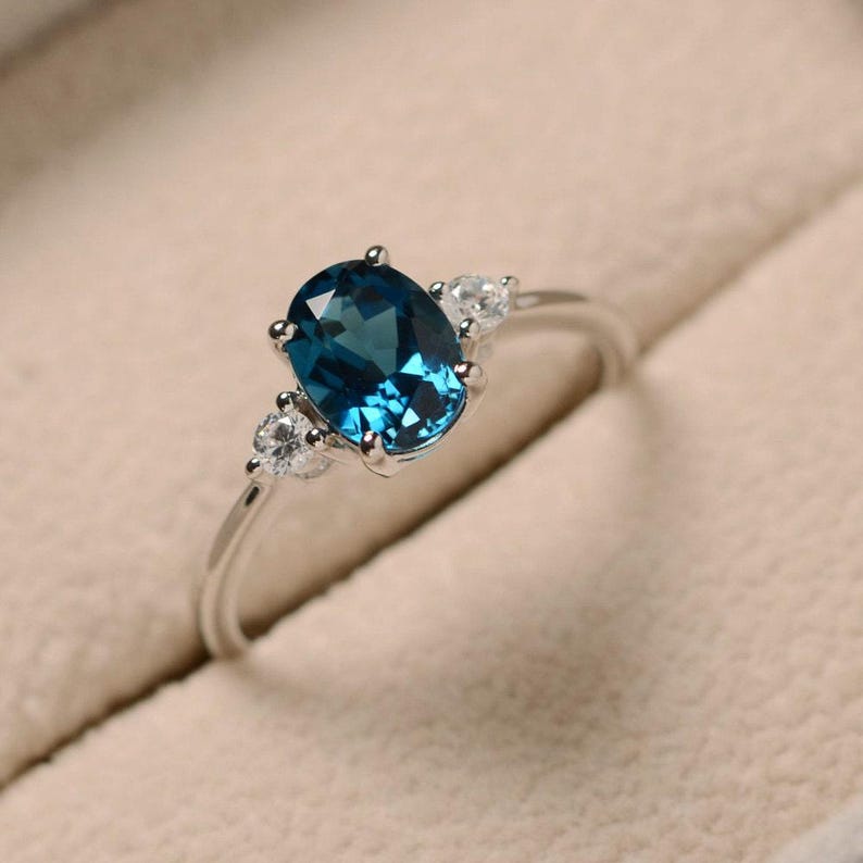 Oval Cut Blue Topaz Ring
